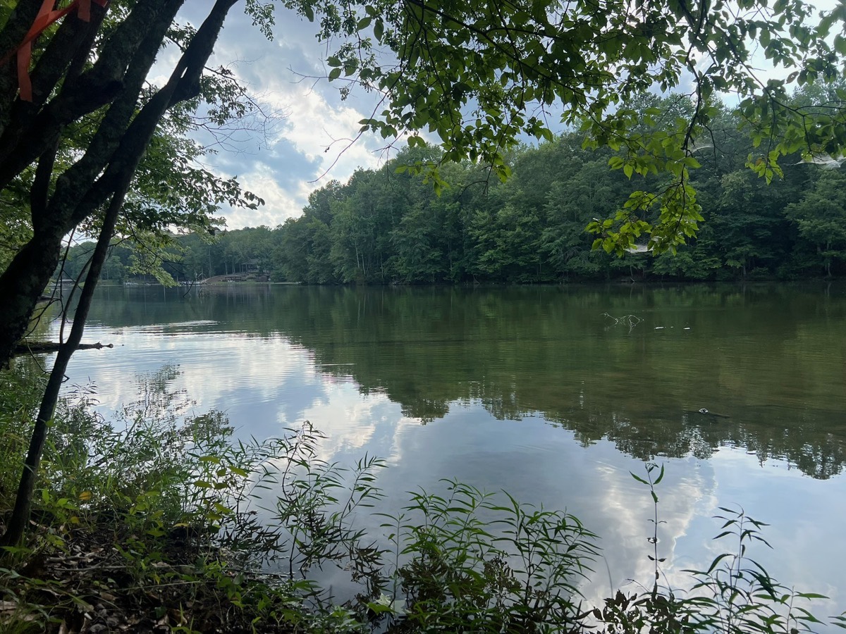 Lake view with dramatic clouds reflected in water